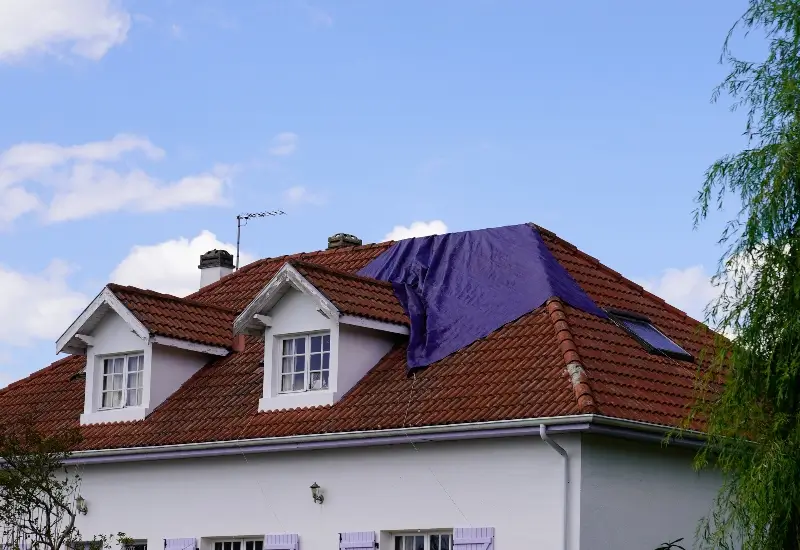 A roof getting repaired after storm damage in Florida